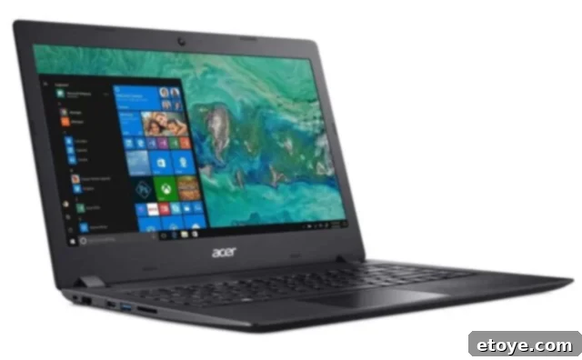 Acer Aspire 1 laptop in a minimalist workspace, showcasing its sleek design and clear display