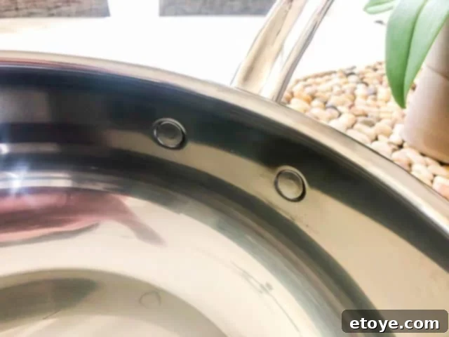 Hestan Nanobond Essential Pan Review & Giveaway 13 Close-up of the flush rivets inside the Hestan Nanobond Essential Pan, demonstrating ease of cleaning