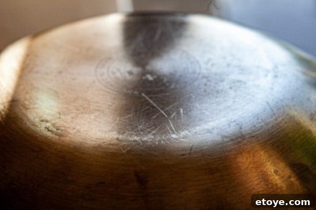 Hestan Nanobond Essential Pan Review & Giveaway 15 Bottom of a competitor's wok showing considerable scratches after 8 months of use