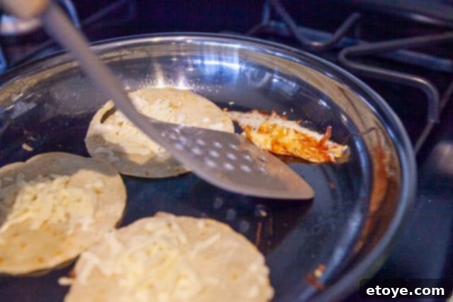 Hestan Nanobond Essential Pan Review & Giveaway 7 Shredded cheese melting on the hot surface of the Hestan Nanobond Frying Pan