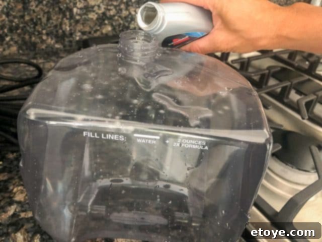 Bissell SpotClean Pro Tested Our Thoughts And Your Chance To Win 7 Filling Bissell SpotClean Pro with solution