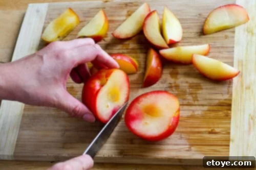 chanterelle-bacon-blue-cheese-plum-salad-41 A plum after the first cut, revealing a clean slice
