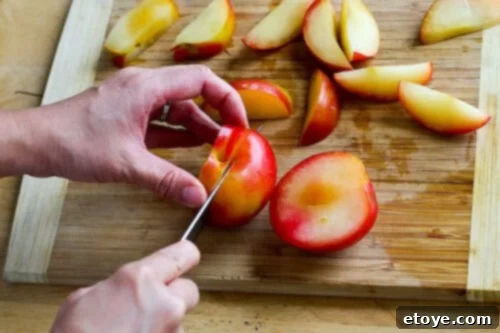 chanterelle-bacon-blue-cheese-plum-salad-42 A plum after two parallel cuts, yielding two large, pit-free sections