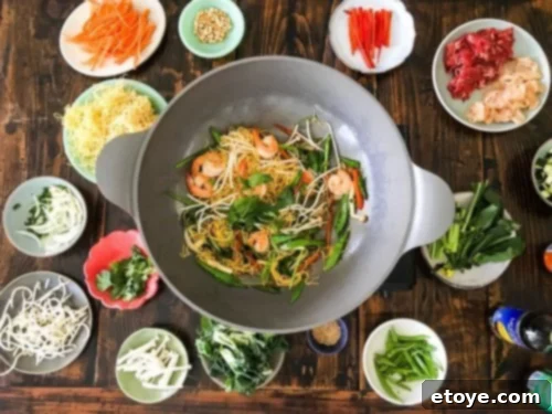 A beautifully arranged table featuring a variety of colorful stir-fry dishes, showcasing different proteins and vegetables, perfect for an easy weeknight dinner