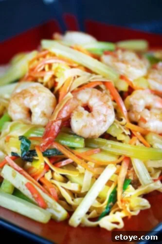 Asian Shrimp Delights 4 Fried noodles with garlic shrimp on a plate
