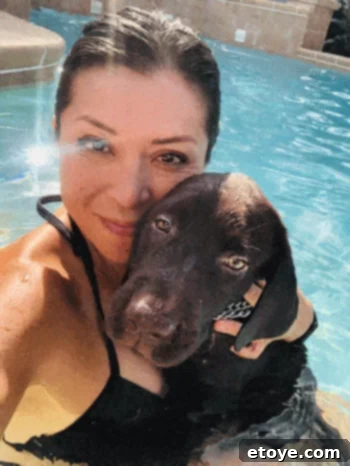 Happy dog with a pet supply haul and a $100 gift card