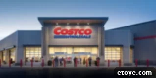 A shopping cart filled with various bulk products from Costco, highlighting the savings potential.