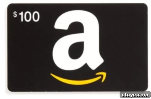 Open box with an Amazon gift card inside, surrounded by shopping bags and a laptop, symbolizing online retail