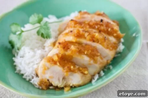 Unforgettable Chicken Creations 23 Pineapple chicken teriyaki served with rice on a blue plate