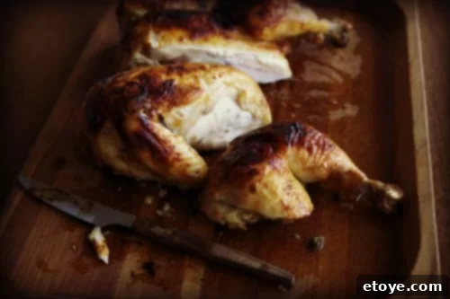 Unforgettable Chicken Creations 25 Miso roast chicken cut into pieces on a chopping board