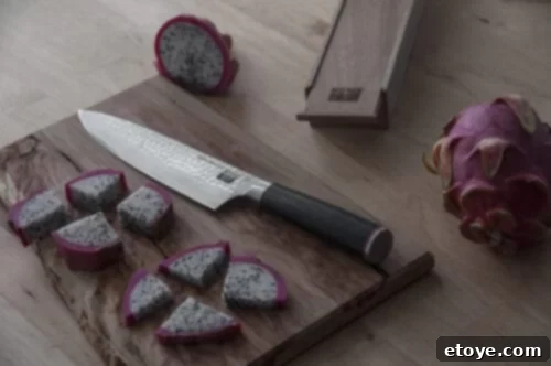 Close-up of the KOTAI Gyuto Knife's hammered blade
