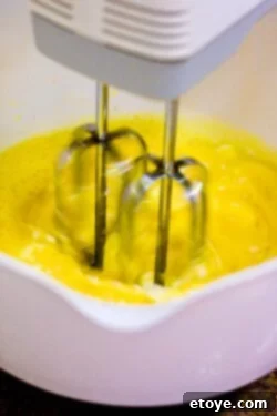 Spices being added to the egg and milk mixture