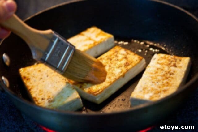 The Ultimate Crispy Tofu & Ponzu Buddha Bowl 5 pan searing tofu for crispy tofu buddha bowl recipe