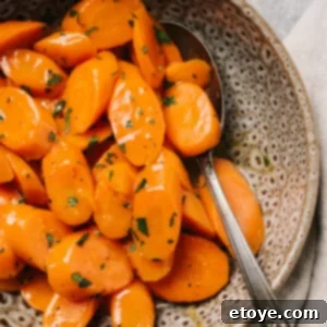A bowl of microwaved steamed carrots, ready to serve.