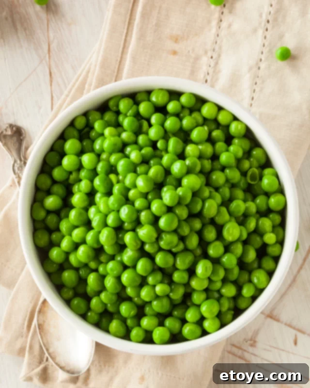 Freshly steamed peas in a bowl, ready to serve
