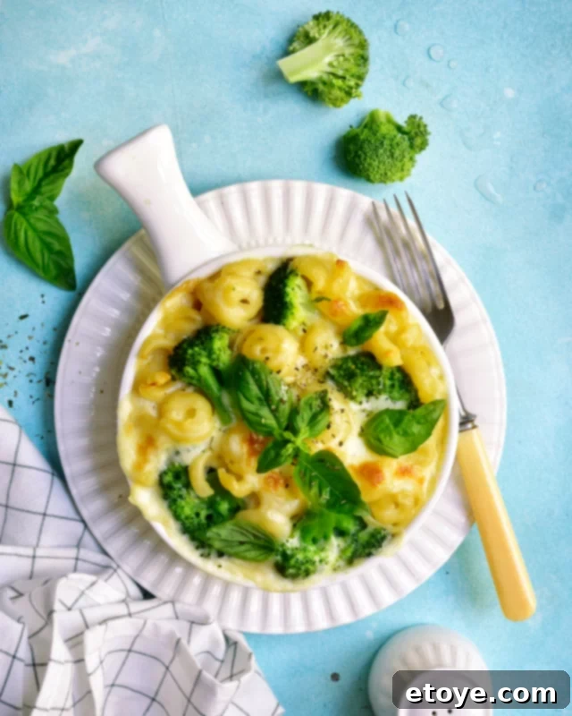 Easy Microwave Steamed Broccoli 4 A bowl of microwave steamed broccoli garnished with lemon wedges and grated cheese.