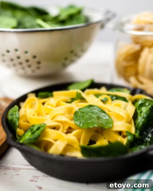 Microwave Noodle Hacks 5 A freshly cooked bowl of microwave pasta topped with sauce and herbs