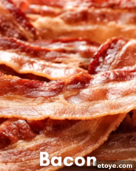Perfect Microwave Bacon Every Time 3 Raw bacon slices arranged on a paper towel-lined plate