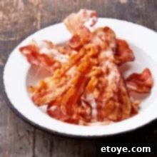 Perfect Microwave Bacon Every Time 5 delicious cooked bacon on plate