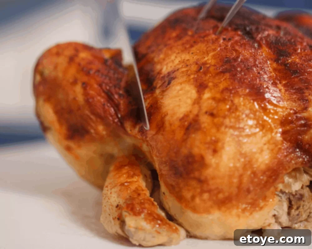Golden brown, perfectly roasted rotisserie chicken, ready to be shredded for a quick and healthy meal.
