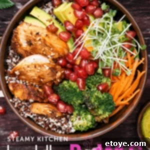 Overhead view of a beautiful Rotisserie Chicken Buddha Bowl, showcasing all its colorful and fresh ingredients beautifully arranged.