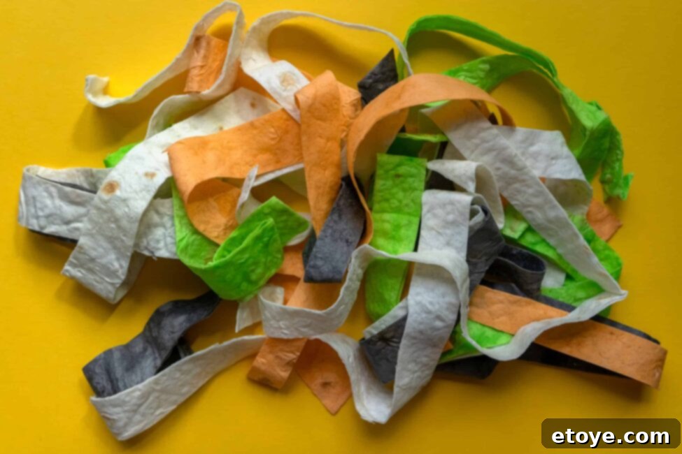 Creamy Cilantro Shrimp and Avocado Buddha Bowl 8 Colorful tortilla strips, cut and ready to be baked into crispy garnishes for Buddha bowls.