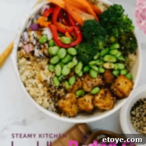 Crispy Roasted Tofu Buddha Bowl with Pineapple Teriyaki Sauce, a healthy and delicious plant-based meal.