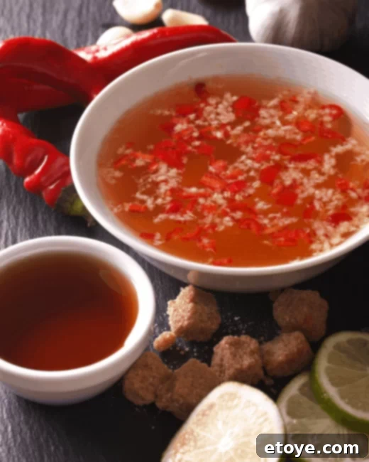 Nuoc Cham The Flavorful Heart of Vietnam 4 Nuoc Cham dressing with added chili and shredded vegetables, showcasing a spicier and more textured version.