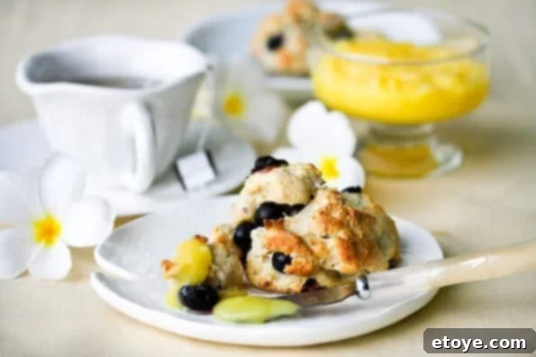 Homemade Scones: Blueberry with Zesty Lemon Glaze Close-up of fluffy Blueberry Scones with Lemon Glaze
