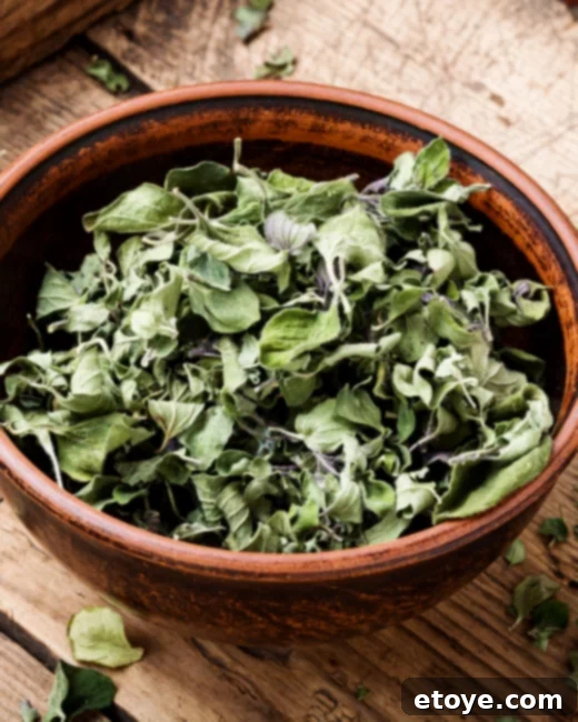Quick Microwave Herb Drying 2 Fresh herbs being prepared for microwave drying on a white plate
