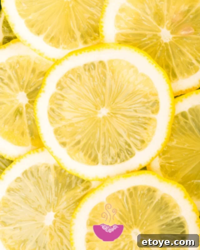 Unlock More Juice From Your Lemons 2 Close-up of fresh, vibrant lemons on a kitchen counter, ready for juicing
