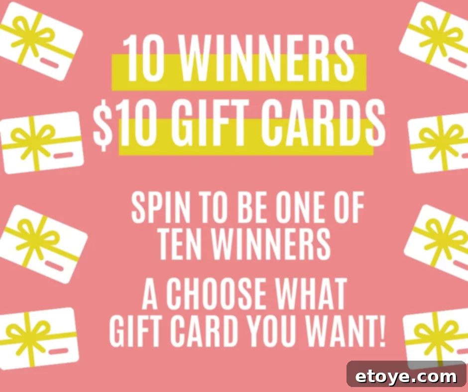 Choose Your Instant Win 3 A hand holding a smartphone displaying a sweepstakes wheel, with various gift cards in the background.