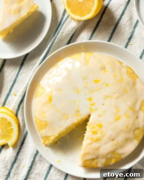 Making the Most of Sour Milk 4 Buttermilk lemon pound cake served on a white plate with a fork