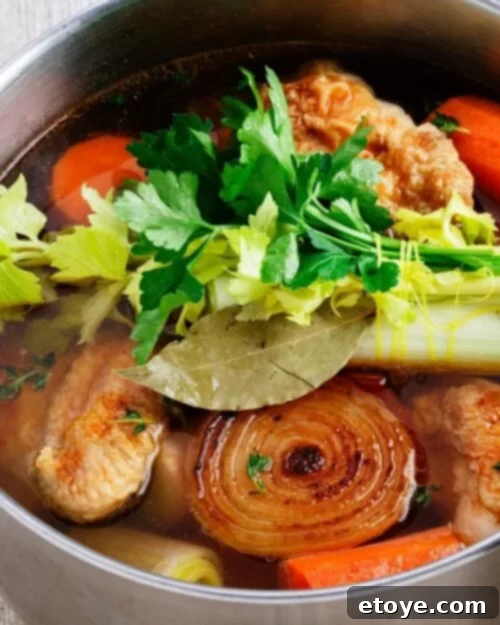 Crafting Perfect Bone Broth 3 A large pot filled with water, various bones, and colorful vegetables, simmering gently on a stovetop, ready to become nourishing bone broth.