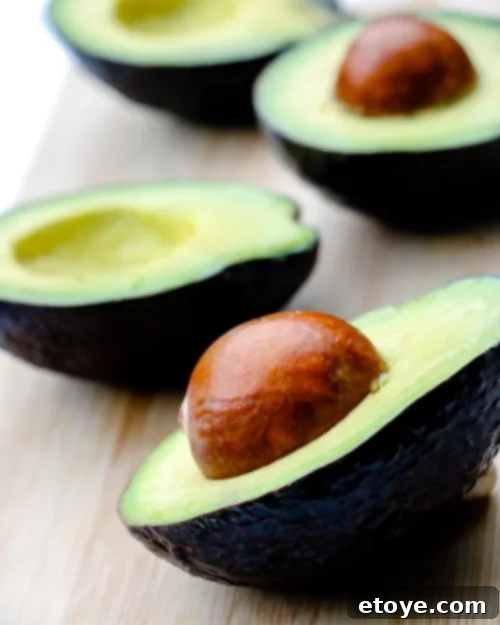 Maximize Fruit Freshness: Smart Storage Solutions 3 A vibrant assortment of fruits and vegetables, neatly stored in a clear container.