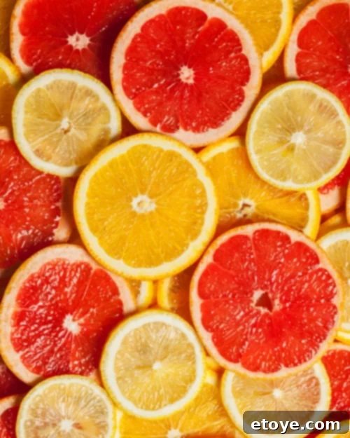 Maximize Fruit Freshness: Smart Storage Solutions 6 A colorful array of citrus fruits, including oranges, lemons, and limes.
