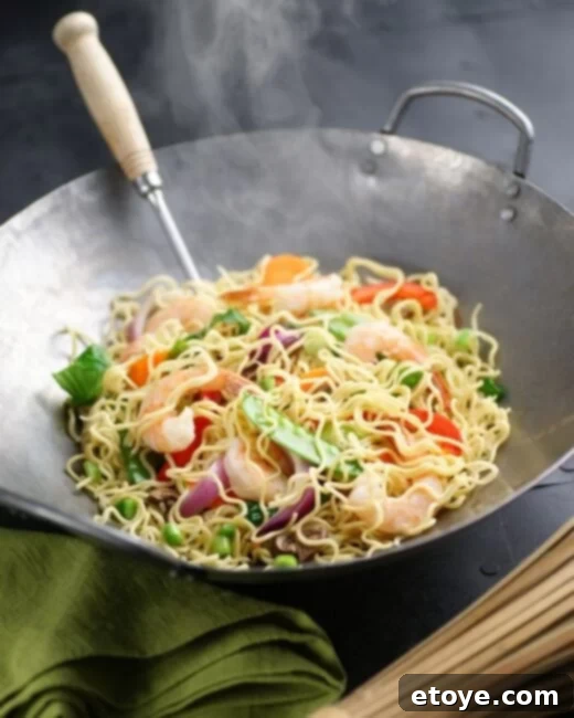 Delicious Shrimp Chow Mein served in a wok, ready to be enjoyed.