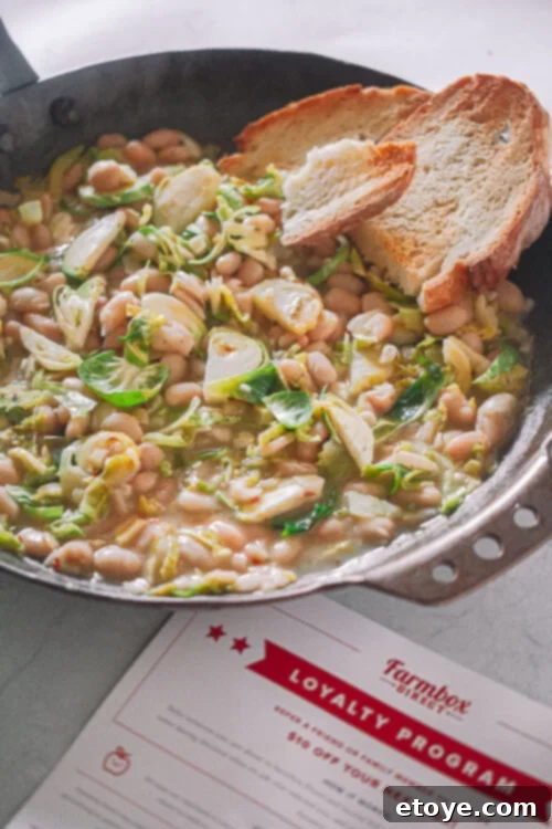 Farmbox Direct: Full Review and Exclusive Giveaway 5 A person holding a bountiful harvest of organic fruits and vegetables, freshly delivered