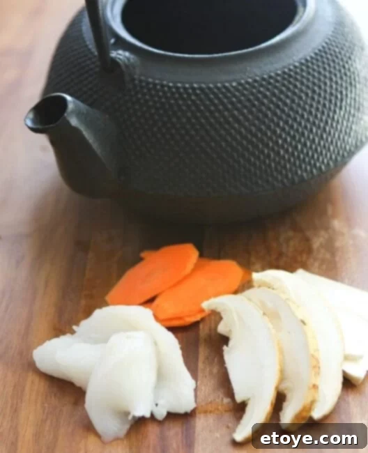 matsutake-dobin-mushi-mushroom-recipe-015 Assorted ingredients for Dobin Mushi, including sliced Matsutake, fish, and carrots