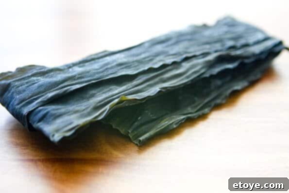 matsutake-dobin-mushi-mushroom-recipe-007 Preparing kombu for dashi, showing a 6-inch piece of dried kelp