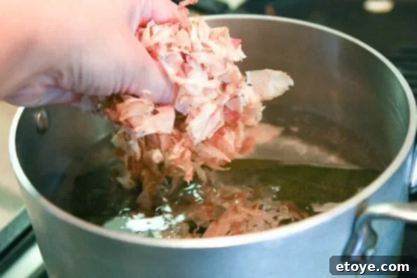 matsutake-dobin-mushi-mushroom-recipe-009 Bonito flakes added to hot dashi water, infusing flavor before straining