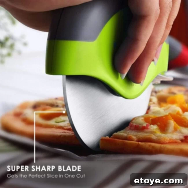 Win Instant Kitchen Gadgets 5 Sharp Kitchy pizza cutter wheel with ergonomic handle slicing through a fresh pizza