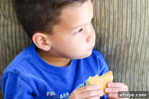 Nathan smiling with a plate of various shaped buttermilk biscuits