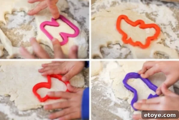 Various cookie cutters used to shape buttermilk biscuit dough, including novelty shapes