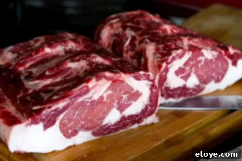 Cutting the beef loin in half for easier dry aging