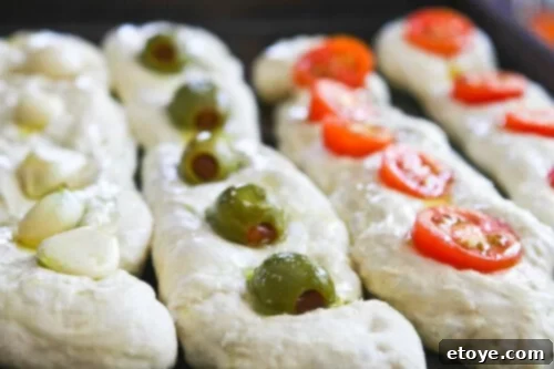 No-Knead Baguette loaves baking in a high-temperature oven, turning golden brown