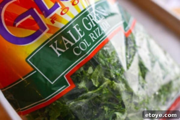 A large bag of fresh kale, ready for preparation