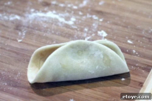 Pan Fried Pork and Shrimp Potstickers Recipe - pleating