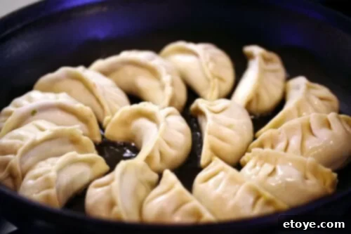 Pan Fried Pork and Shrimp Potstickers Recipe - pleating