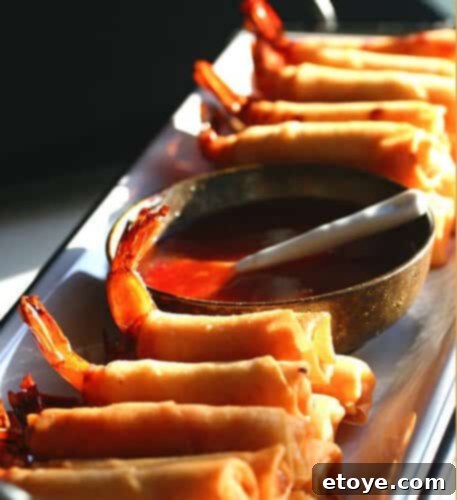Firecracker Shrimp with Sweet Chili Sauce Platter of golden Firecracker Shrimp with Sweet Chili Sauce, ready to be served